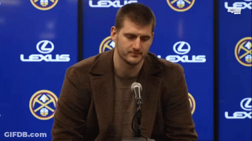 Man Sitting In Front Of Lexus Sign GIF