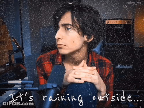 Man Sitting In Front Of Marshall Amp In Rain GIF