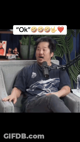 Man Sitting In Front Of Microphone With Word OK GIF