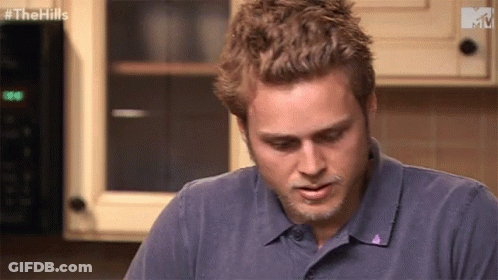 Man Sitting In Front Of Microwave GIF