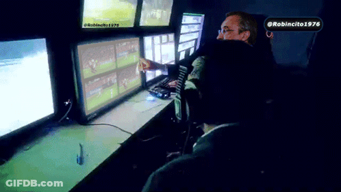 Man Sitting In Front Of Monitors With Robincito 1976 Sticker GIF