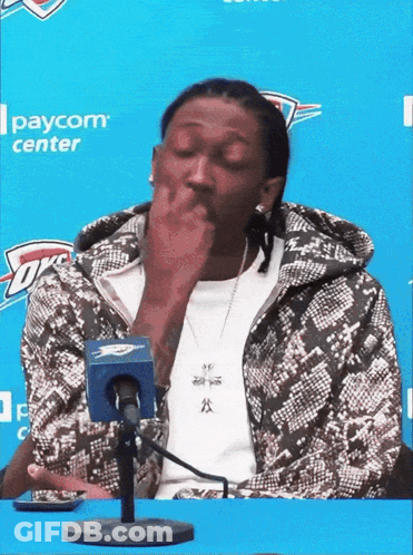 Man Sitting In Front Of Paycom Center Microphone GIF