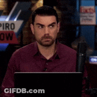 Man Sitting In Front Of Piro Sign GIF