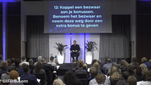Man Sitting In Front Of Screen Saying Koppel Een Bezwaard Aan Je Bonussen GIF