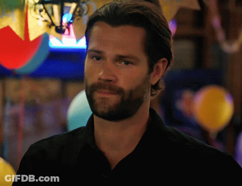 Man Sitting In Front Of Screen Saying Open GIF