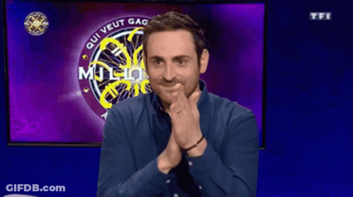 Man Sitting In Front Of Screen Saying Qui Veut Gagner Million GIF