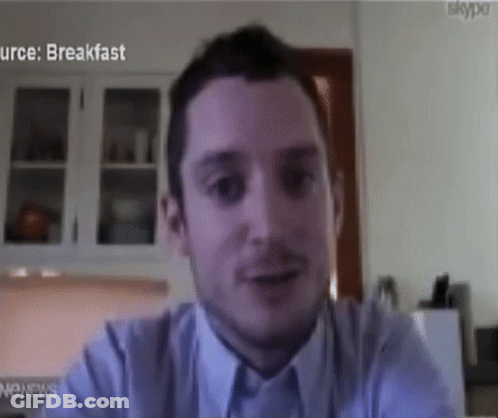 Man Sitting In Front Of Skype Screen GIF