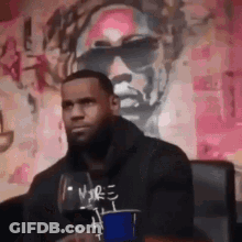 Man Sitting In Front Of Sunglasses Hoodie Painting GIF
