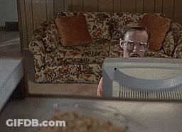 Man Sitting In Front Of Television In Living Room GIF