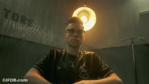 Man Sitting In Front Of Tors Wall GIF