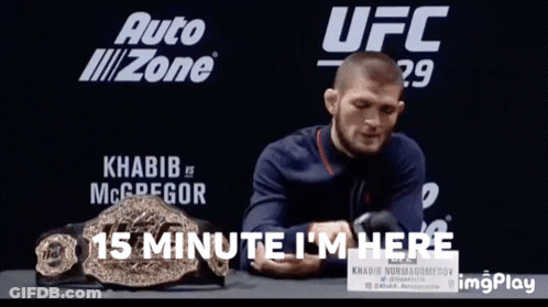 Man Sitting In Front Of UFC Sign GIF