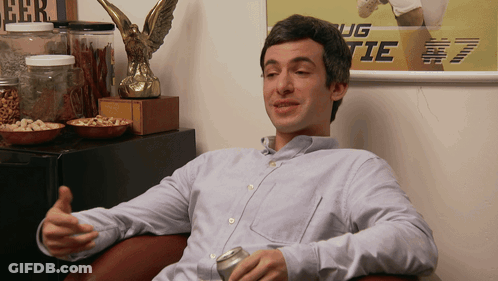 Man Sitting In Front Of Ug Tie Poster GIF