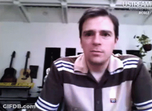 Man Sitting In Front Of Ustream Recorded Live Mobile Screen GIF