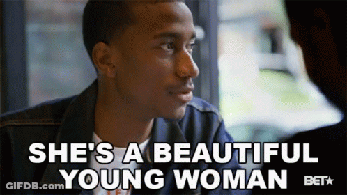 Man Sitting In Front Of Window Saying She's A Beautiful Young Woman GIF