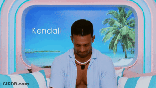 Man Sitting In Front Of Window With Name Kendall GIF