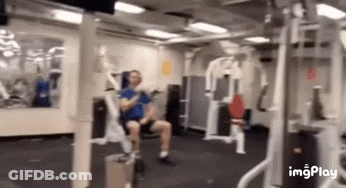 Man Sitting In Gym Using Machine GIF