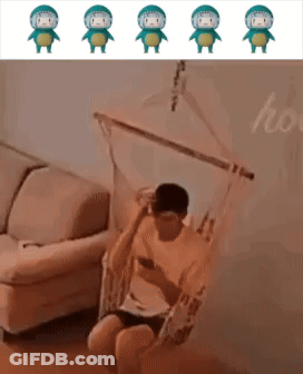 Man Sitting In Hammock Looking At Phone GIF