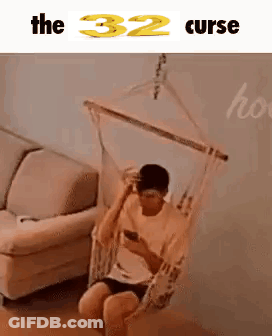 Man Sitting In Hammock Looking At Phone GIF