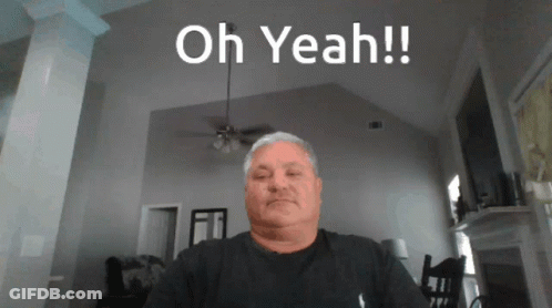 Man Sitting In Living Room Saying Oh Yeah GIF