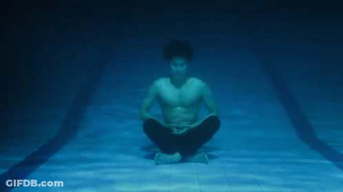Man Sitting In Lotus Position Underwater GIF