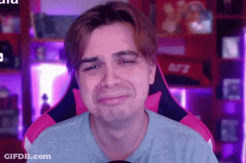 Man Sitting In Pink And Black Chair Sad GIF