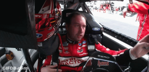 Man Sitting In Race Car Wearing Ford Shirt GIF