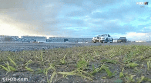 Man Sitting In Race Car Wearing Ford Shirt GIF