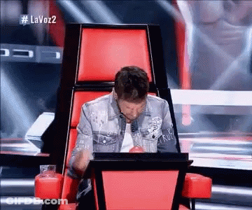 Man Sitting In Red Chair With Laptop GIF