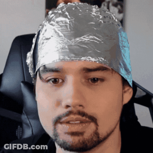 Man Sitting In Red Cooler In Flooded Street GIF
