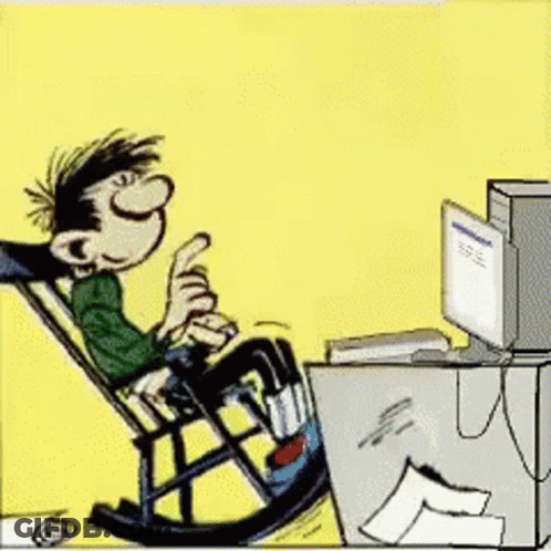 Man Sitting In Rocking Chair Looking At Computer GIF