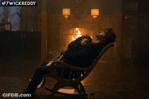 Man Sitting In Rocking Chair With Little Girl GIF