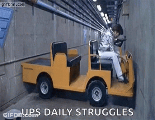 Man Sitting In Small Yellow Truck GIF