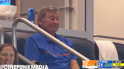 Man Sitting In Stadium Watching Miami Vs Flag Game GIF