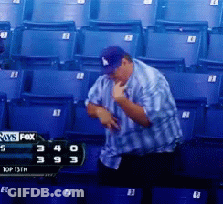 Man Sitting In Stadium With Fox Scoreboard GIF