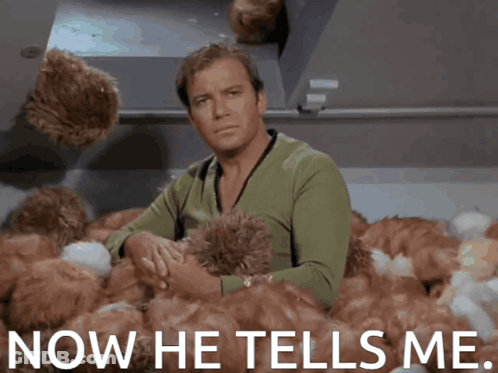Man Sitting In Stuffed Animals Saying Now He Tells Me GIF