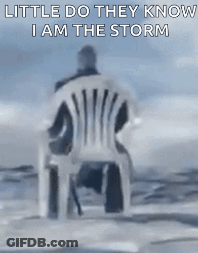 Man Sitting In White Chair Saying Little Do They Know I Am The Storm GIF