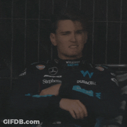 Man Sitting In Williams Racing Jacket GIF