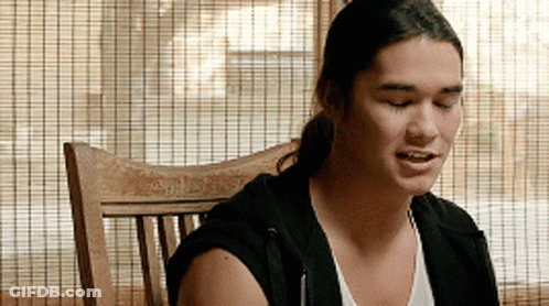 Man Sitting In Wooden Chair With Eyes Closed GIF