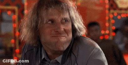 Man Sitting Laughing With Hands On Head GIF