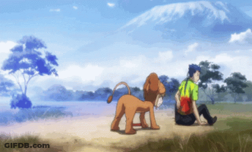 Man Sitting Next To Lion In Field GIF
