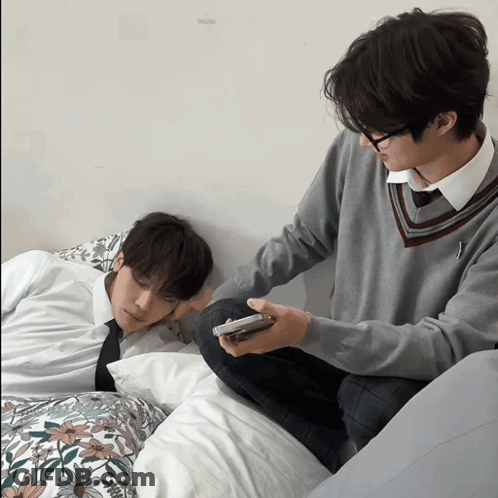 Man Sitting Next To Sleeping Man GIF