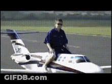 Man Sitting Next To Small Airplane N20 GIF