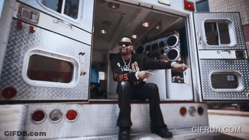 Man Sitting On Back Of Ambulance GIF