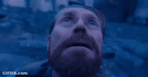 Man Sitting On Beach With MG Letters GIF