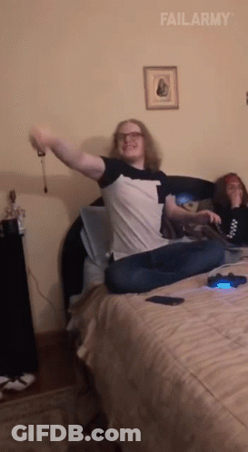 Man Sitting On Bed Arms Outstretched Failarmy GIF