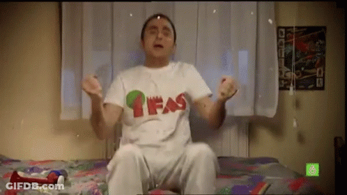 Man Sitting On Bed In White T-Shirt Saying Fas GIF