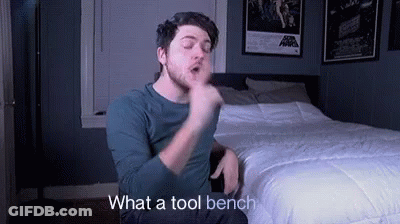 Man Sitting On Bed Making Funny Face GIF