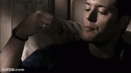 Man Sitting On Bed Making Funny Face GIF