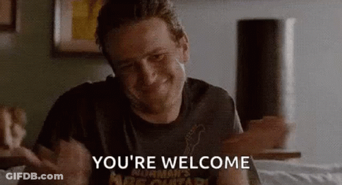 Man Sitting On Bed Saying Youre Welcome GIF