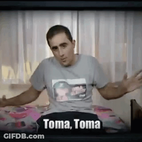Man Sitting On Bed With Arms Outstretched T-Shirt Says Toma GIF